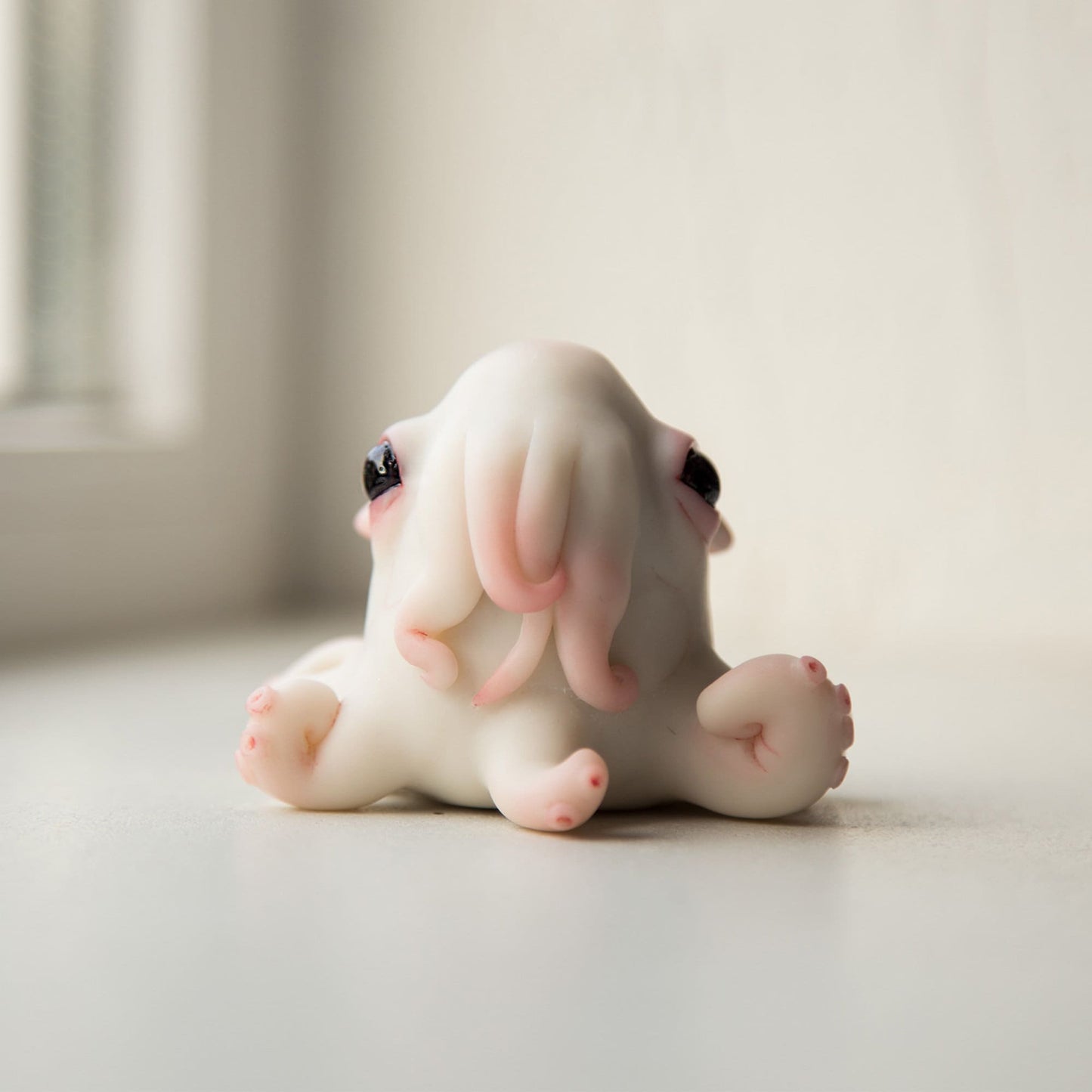 Octopus baby doll sculture, cute cthulhu anime figurine, kraken miniature creature art doll.